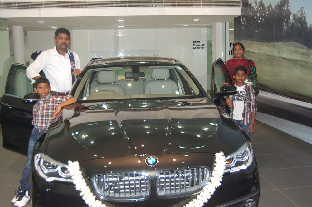 Girish and family with their new BMW 5 Series