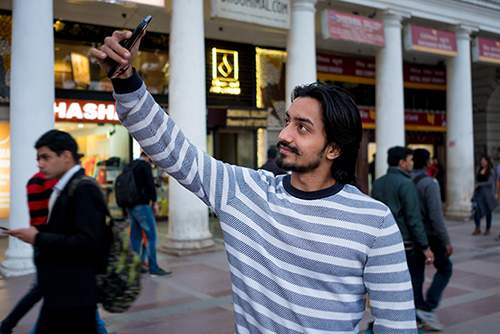 The prevalence of the cheap cell phones and improvement in cell phone camera technology has lead to people taking selfies anywhere and all the time. Photo: Sriram V Murthy.&amp;nbsp;