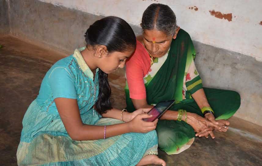 Nirmala-showing-her-video-story-to-her-grand-mother