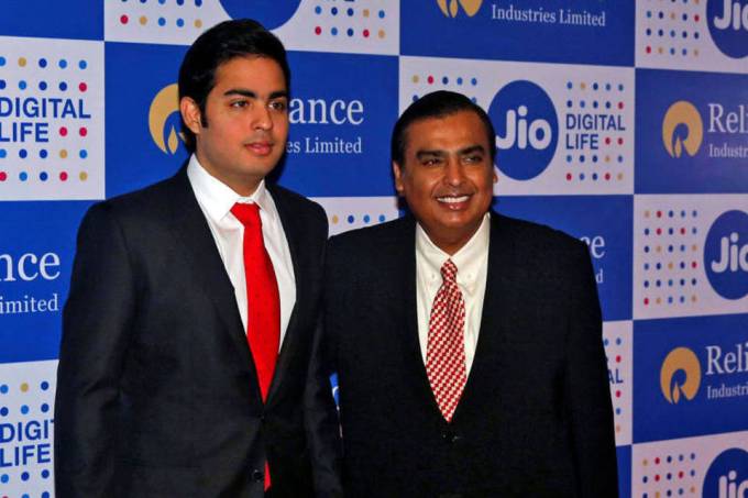 Reliance group chairman Mukesh Ambani (right) with son Akash Ambani, director, Reliance Jio
